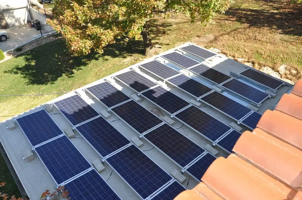 Solar panels on a roof with tiles.